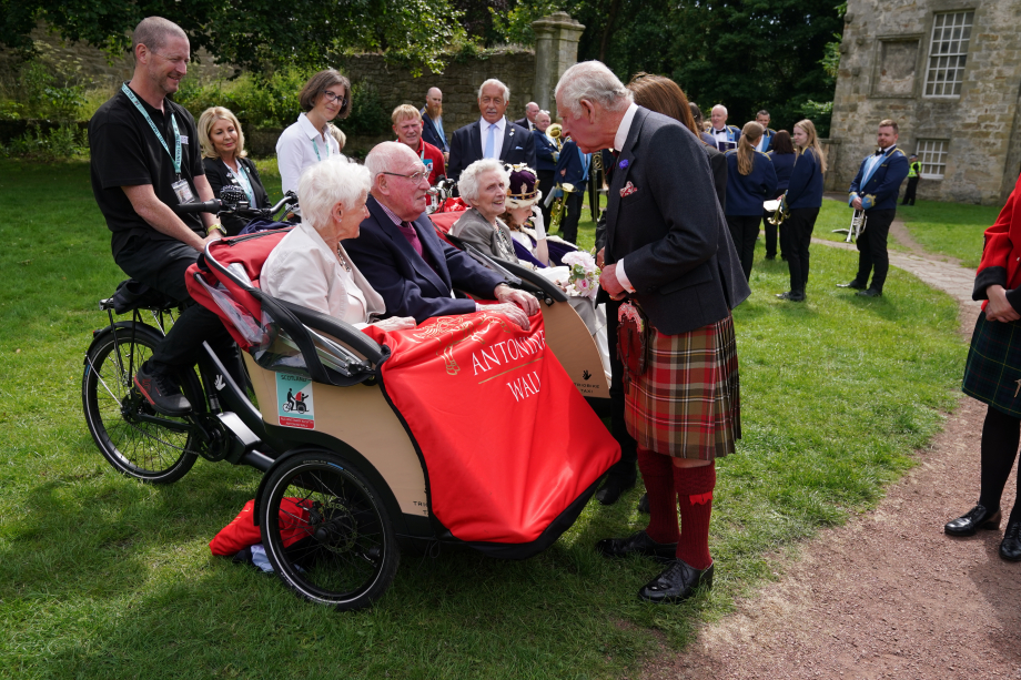 The King meets volunteers and beneficiaries of Cycling Without Age Scotland 