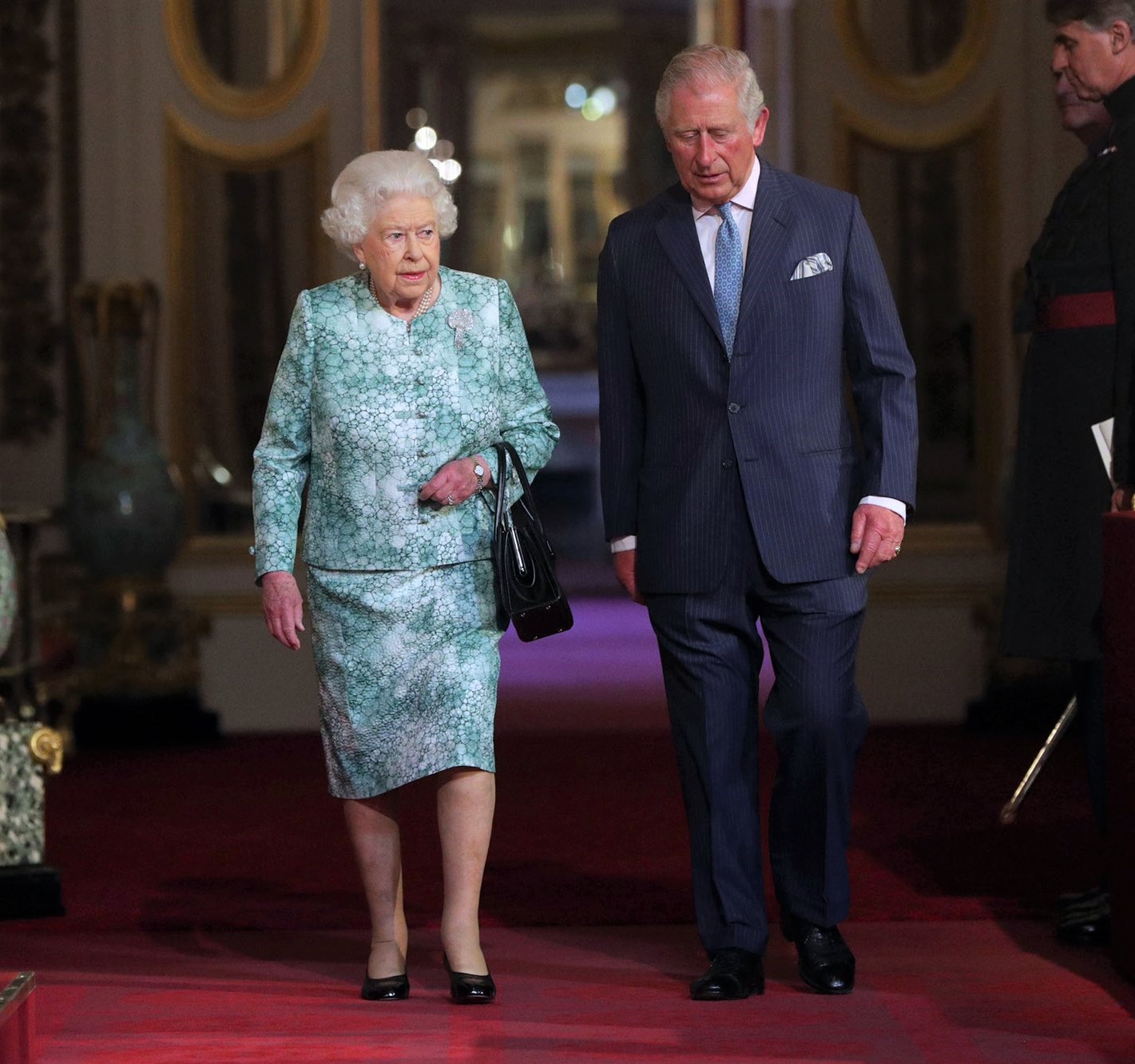 The Queen and The Prince of Wales walking