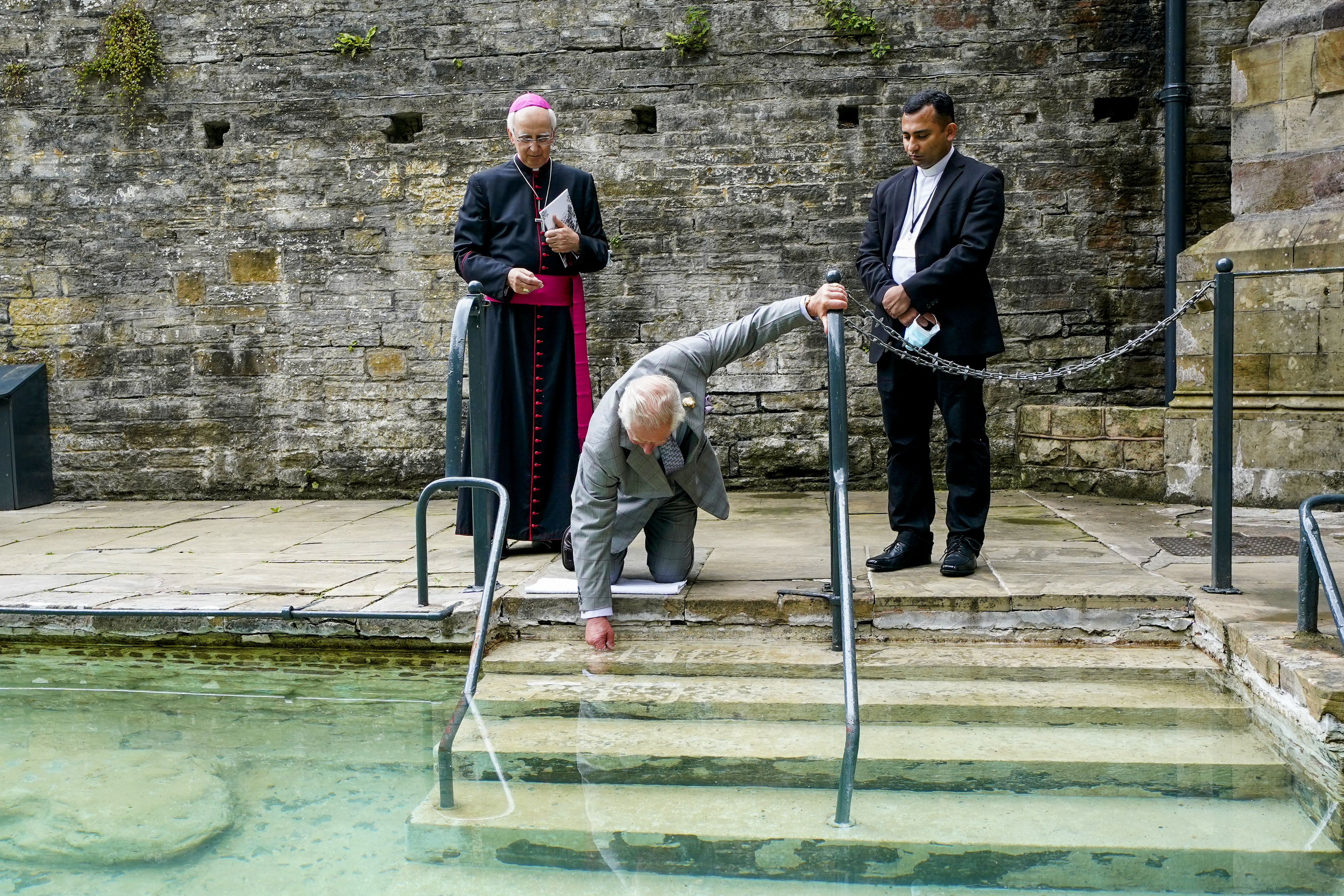 HRH touches the healing waters at St Winefride's Well