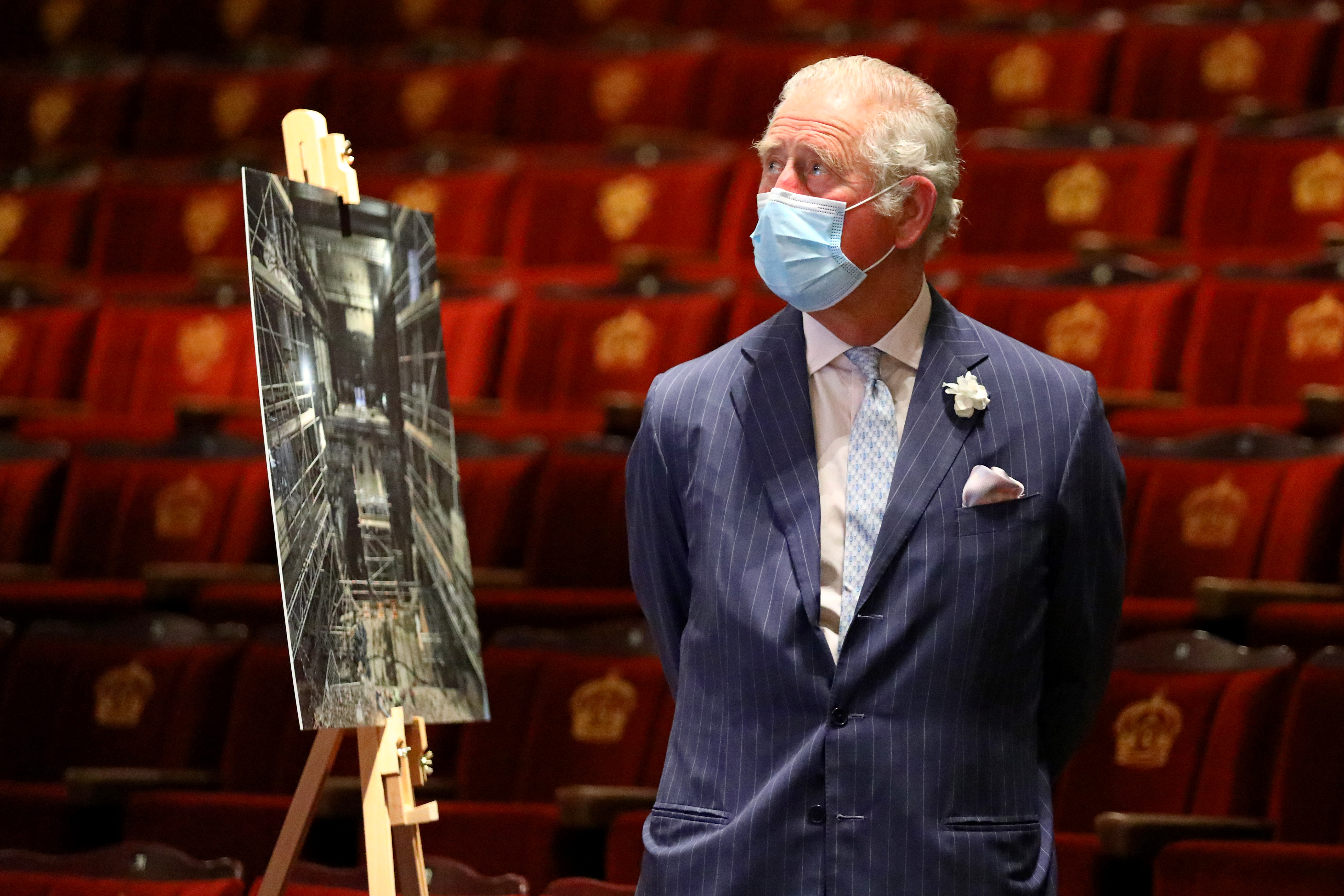 The Prince of Wales is shown the auditorium during a visit to the Theatre Royal Drury Lane, central London, to hear about the restoration of the theatre