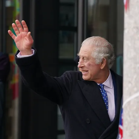 The King waves to crowds