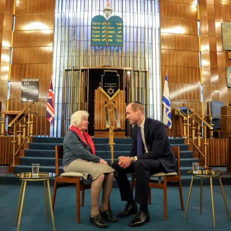 The Prince of Wales meets with a Holocaust survivor at a London Synagogue
