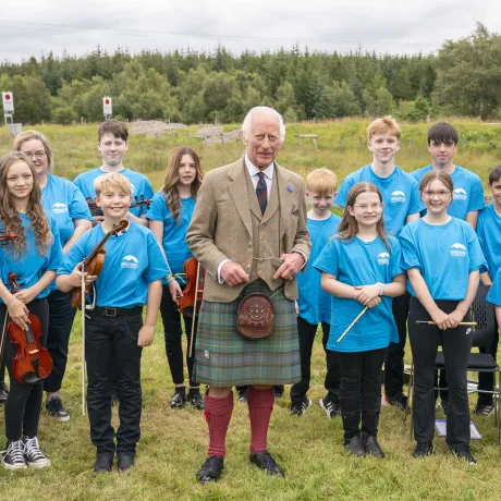 King Charles III meets members of the Feis air an Oir community music group during his visit to the Forsinard Flows Visitor Centre in Forsinard, Highland.jpg