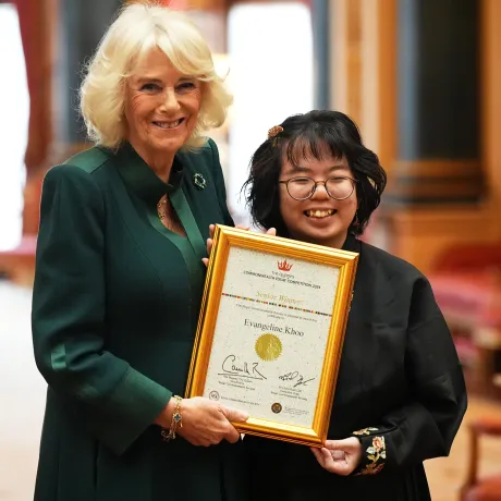 The Queen presents certificates to winners of the Commonwealth Essay Competition