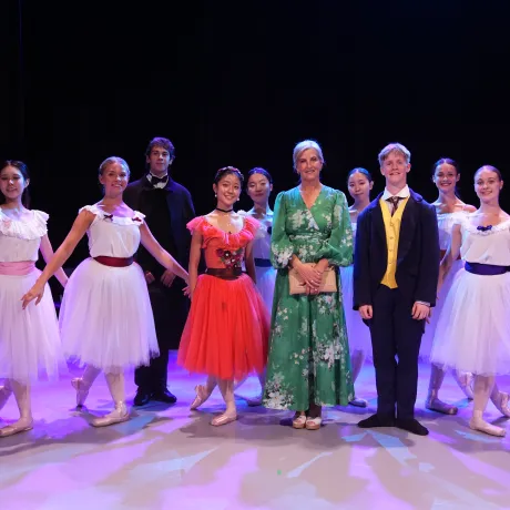 The Duchess of Edinburgh smiles alongside performers from the Central School of Ballet