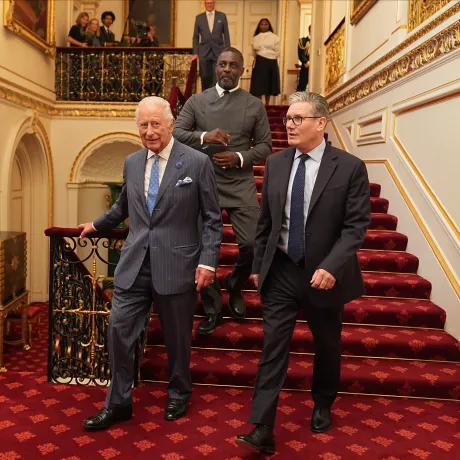 The King walks with Prime Minister Sir Keir Starmer, followed by Idris Elba in St James's Palace