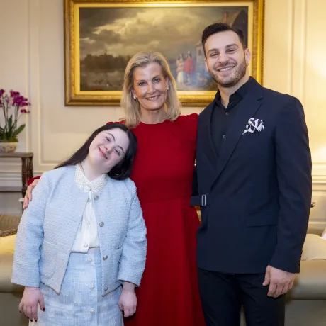 The Duchess of Edinburgh smiles alongside Ellie Goldstein and Vito Coppola