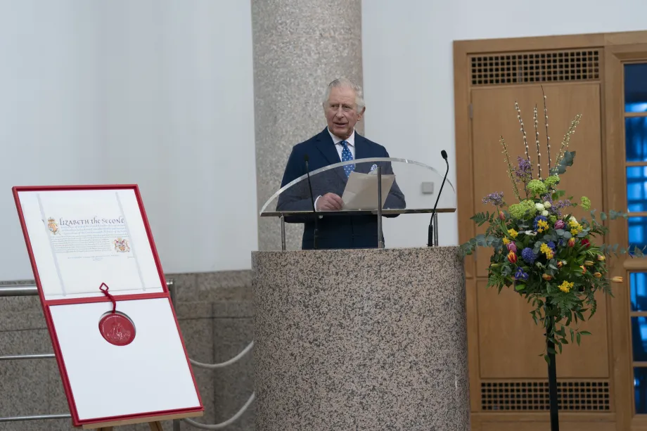The King speaks from a lecturn