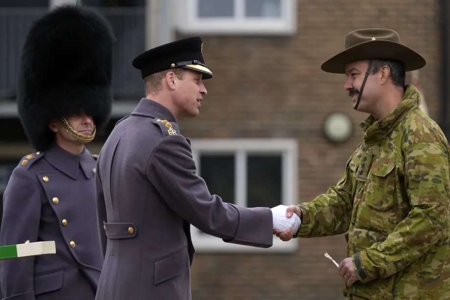 The Prince of Wales with a soldier from the Welsh Guards