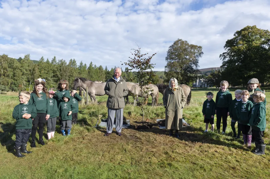 The King and Queen Elizabeth II plant a tree in Balmoral