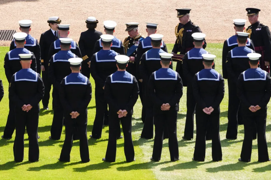 The King presents Royal Navy personnel with RVO medals