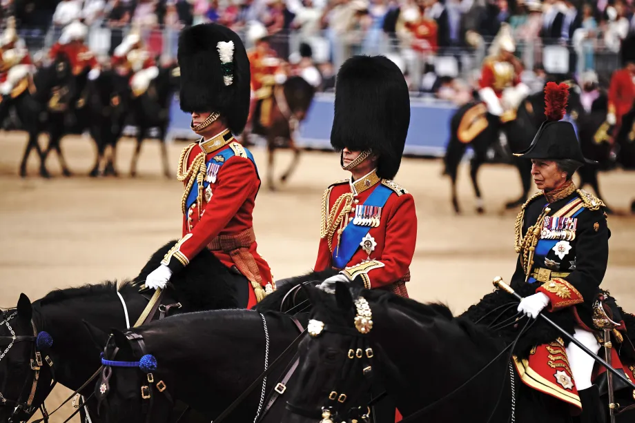 The King, flanked by The Prince of Wales and The Princess Royal