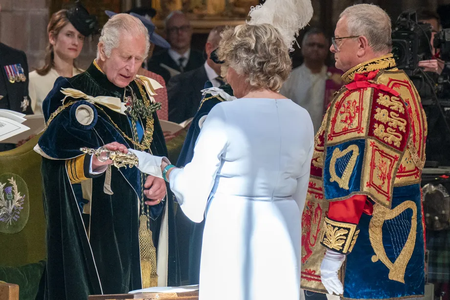 The King is presented with the sword