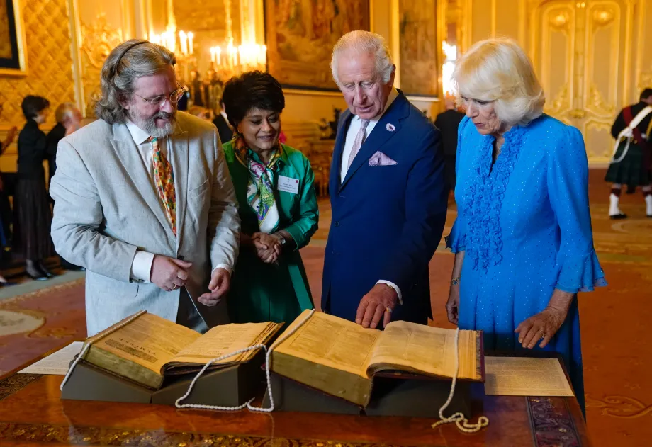 Their Majesties view the folio