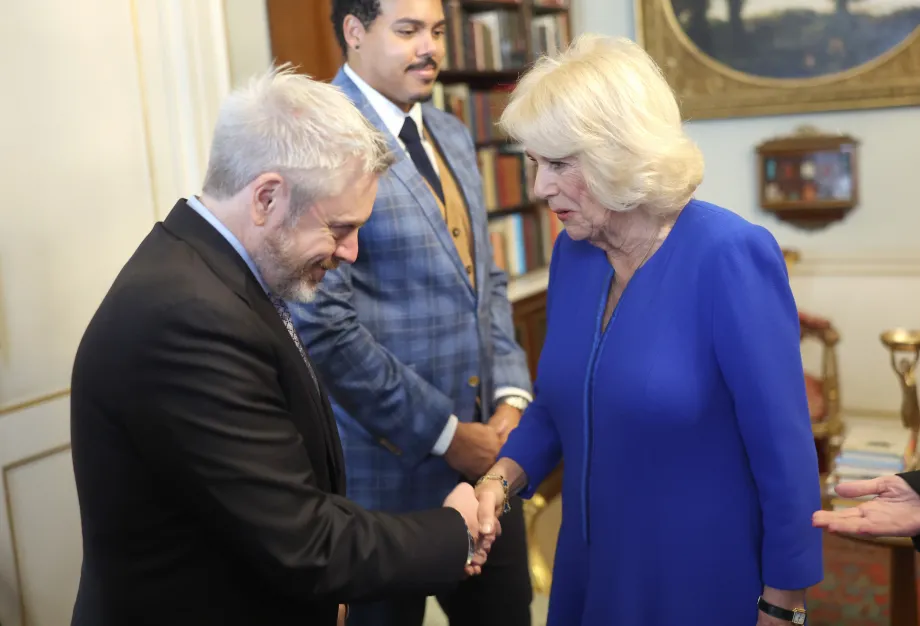 Queen Camilla speaks to author Paul Harding (left) who is nominated for 'The Other Eden', during a reception at Clarence House, London, for the Booker Prize Foundation