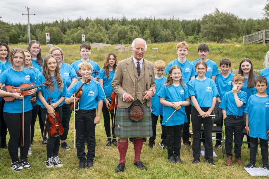 King Charles III meets members of the Feis air an Oir community music group during his visit to the Forsinard Flows Visitor Centre in Forsinard, Highland.jpg