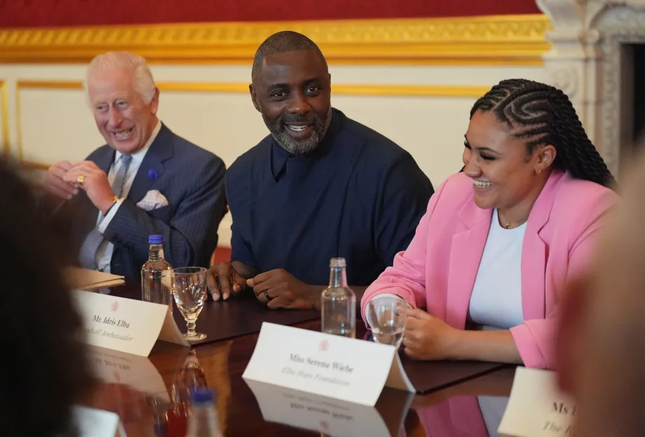 The King, Idris Elba and a young woman sat at the round table discussions
