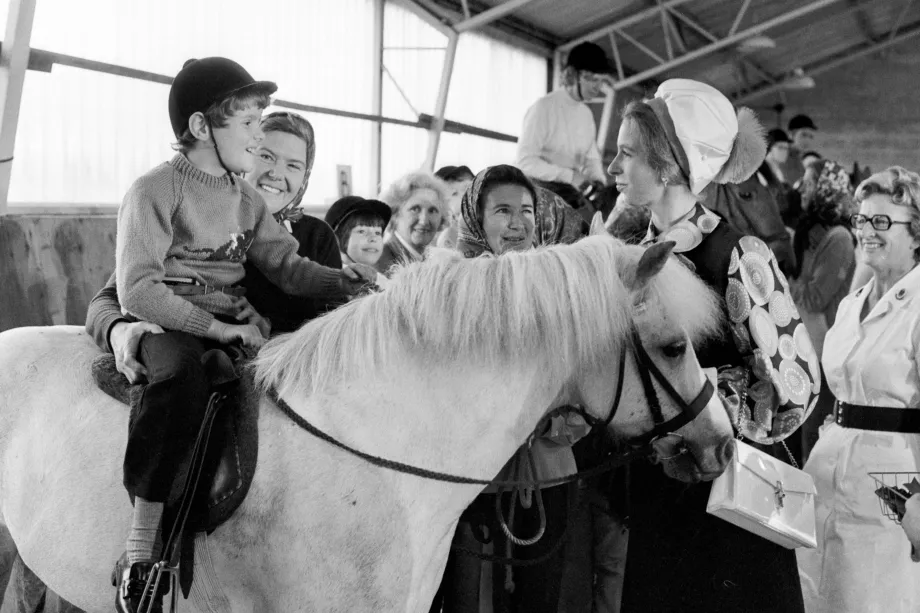 The Princess Royal chats with a young rider during her visit to the Winford Orthopaedic Hospital in Bristol, 1973.