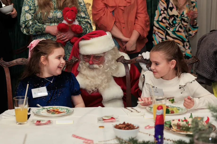 Father Christmas surprises children at Clarence House