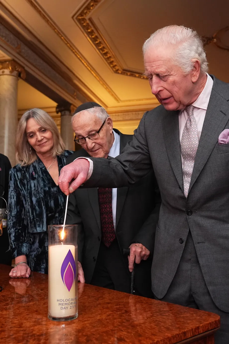 The King lights a candle