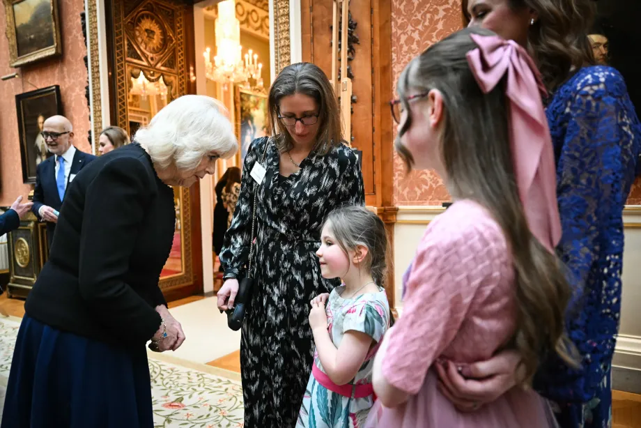 The Queen in discussion with a child