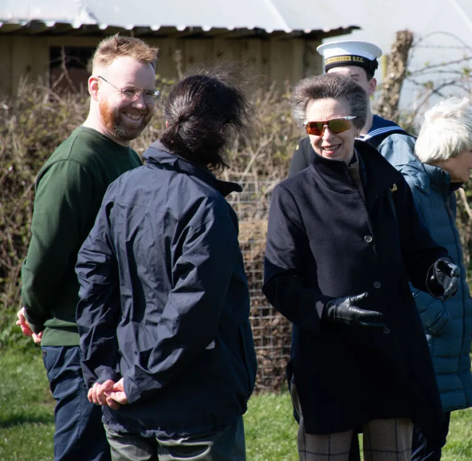 The Princess Royal smiling whilst on the farm