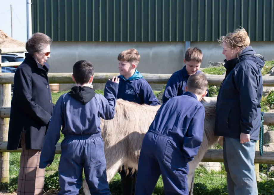 The Princess Royal in conversation with children on the farm