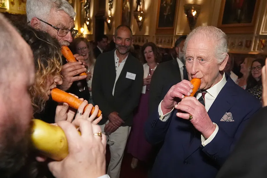 His Majesty playing a carrot recorder alongside the London Vegetable Orchestra