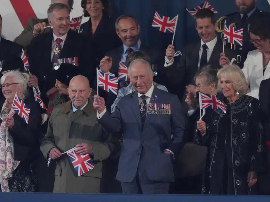 The Royal Family wave flags at the concert