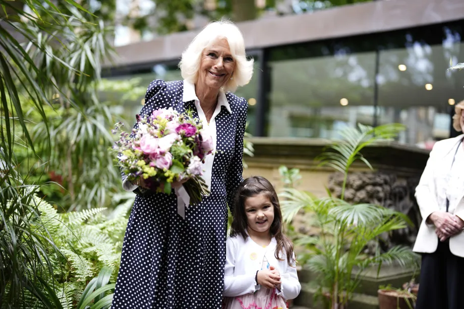 The Queen receives flowers from four-year-old Darcie Donaldson