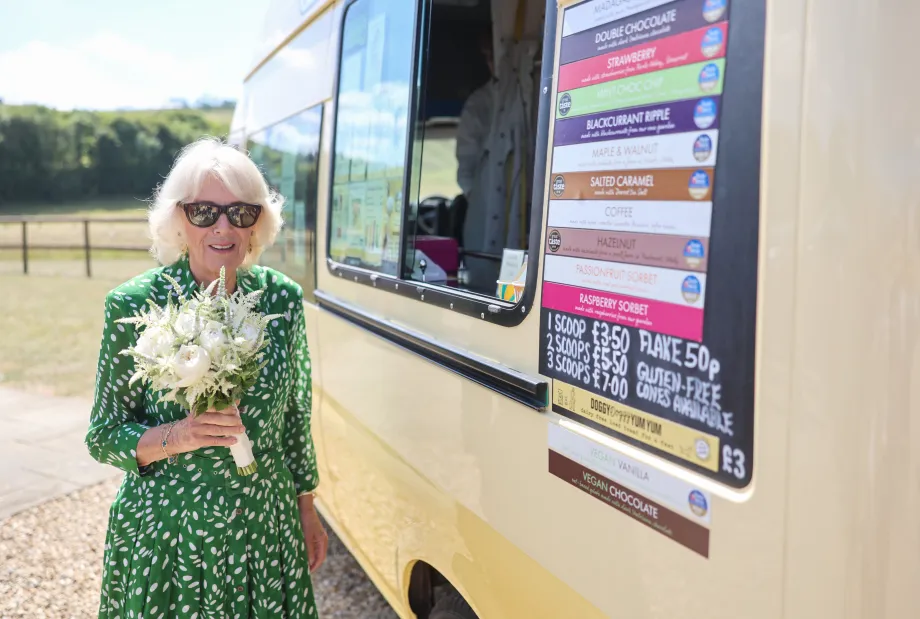 The Queen smiles next to Joanna Weaver's ice cream van