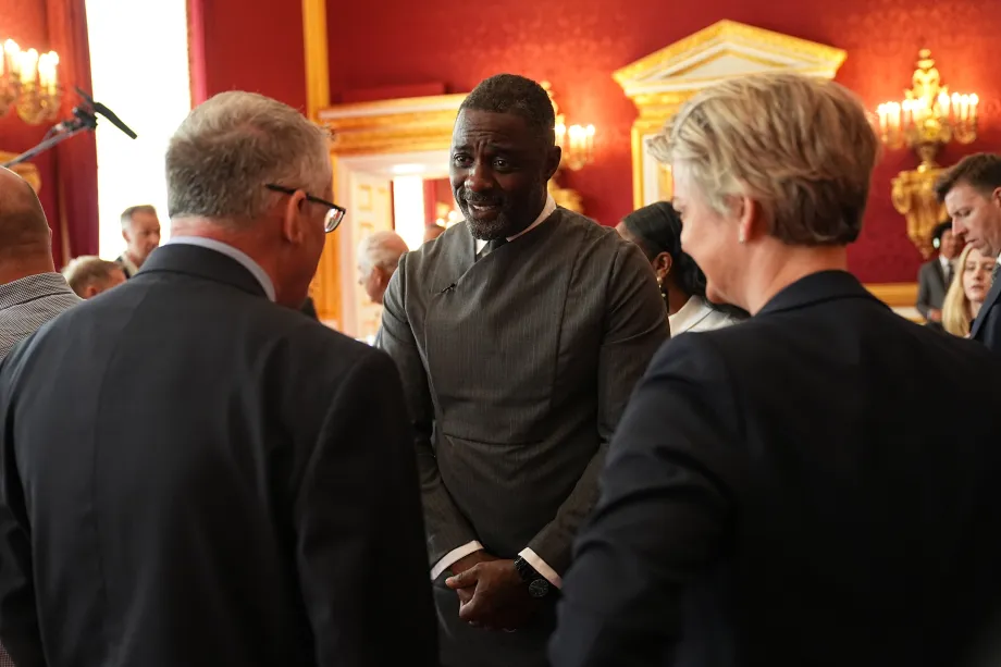 Idris Elba speaks to guests during the Youth Opportunity Summit