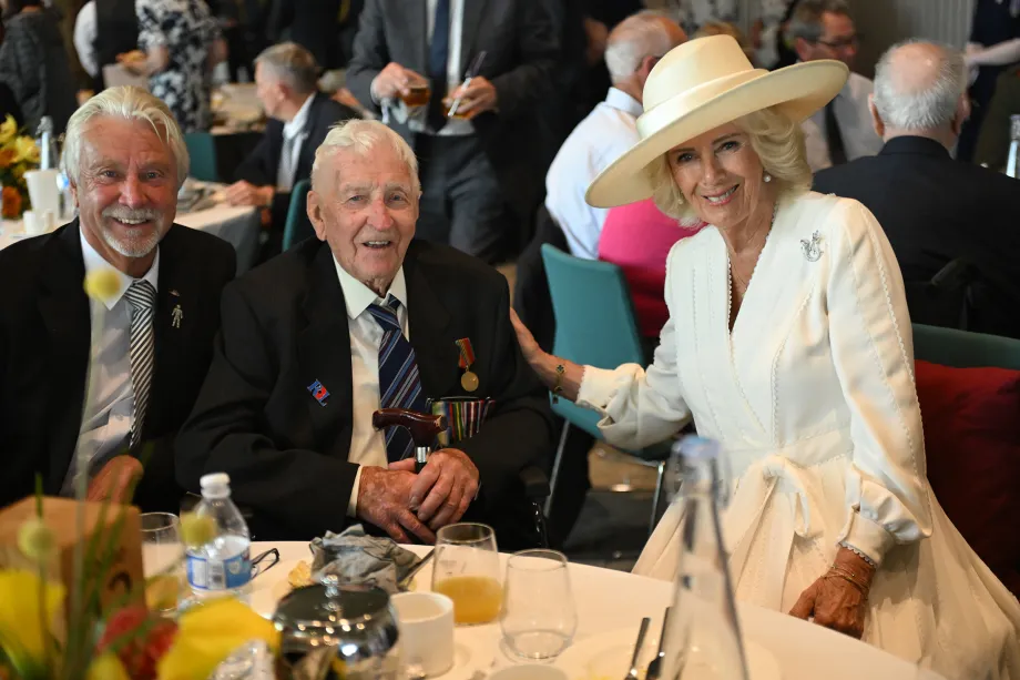 The Queen with Bob Gelder and his eldest son Kim during a reception for VJ veterans and their families hosted by the Royal British Legion