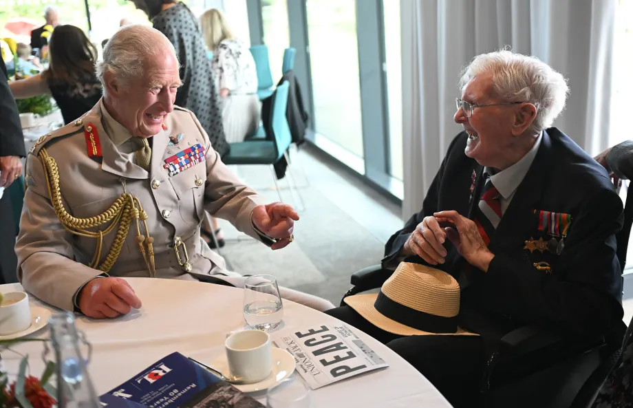 The King laughs with veteran Charlie Richards