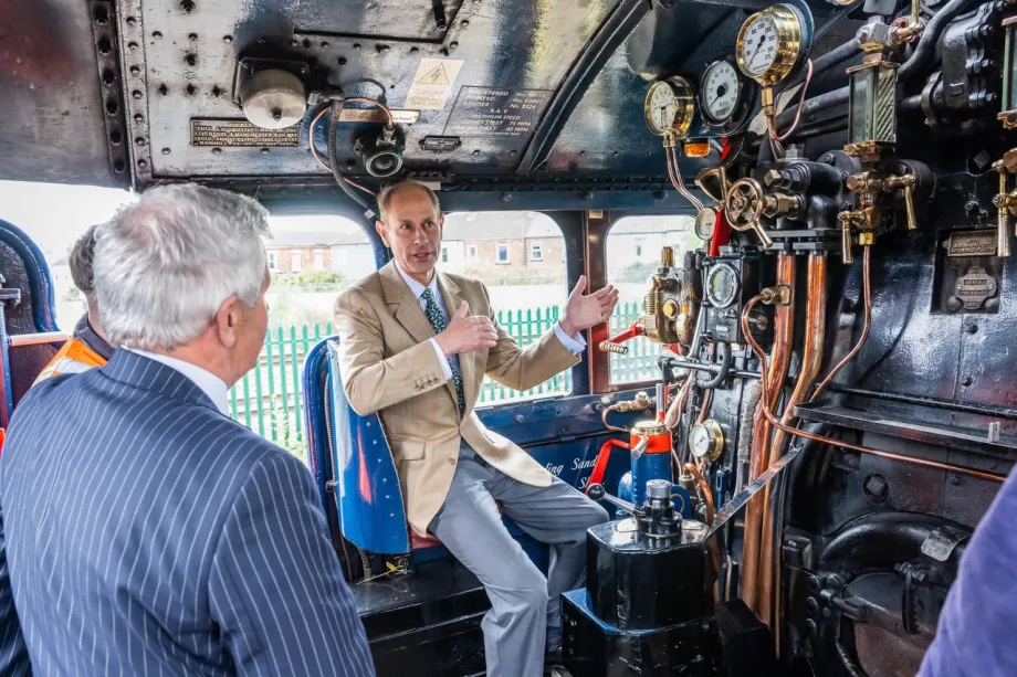 The Duke of Edinburgh tours a train and looks at an engine 