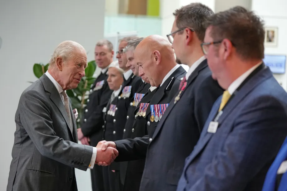 The King meets representatives from Greater Manchester Police Force, Ambulance Service, and Fire and Rescue Service