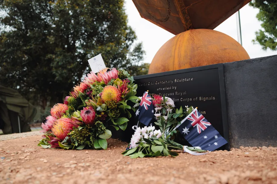 A wreath is laid at the sculpture