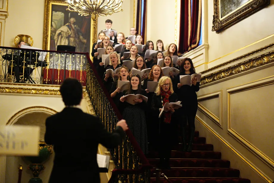 The Royal Household performs during the Christmas tea party