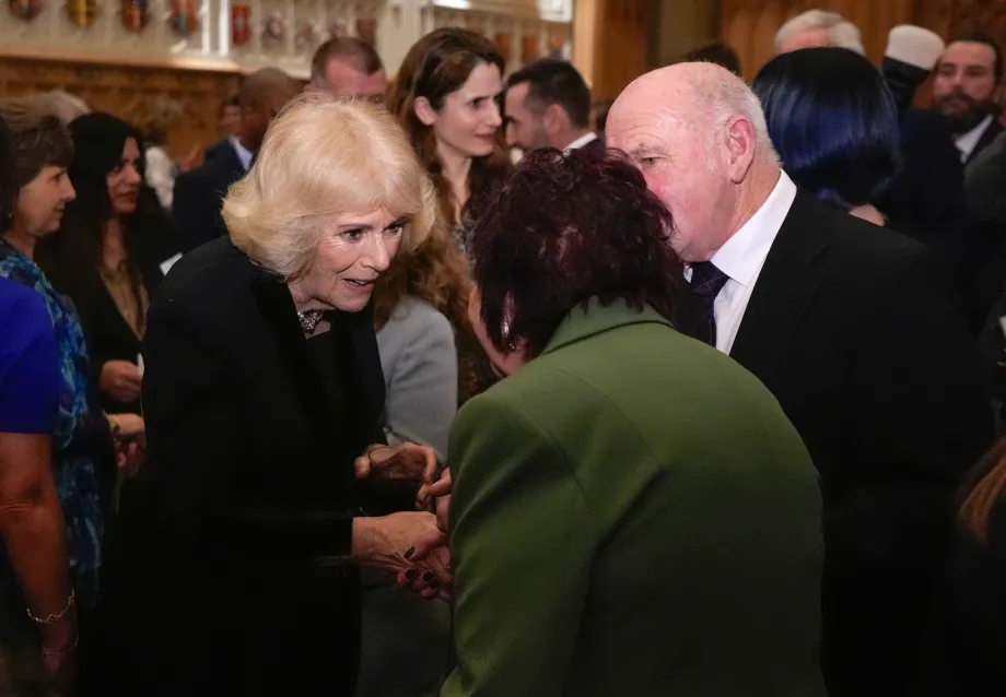The Queen meets guests at a reception to celebrate carers