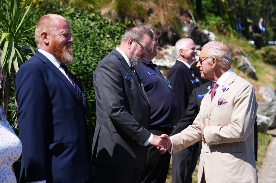The King meets people on the beach in the Isle of Man