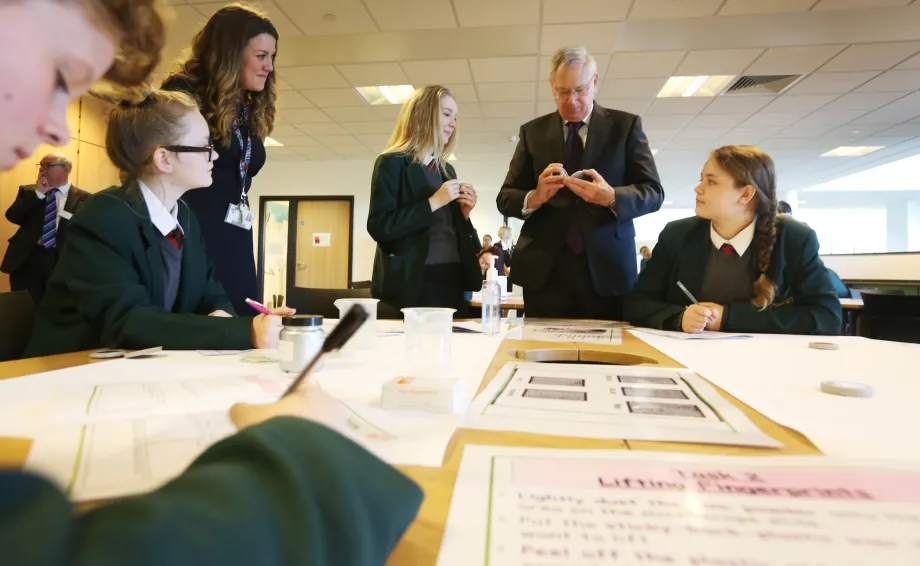 The Duke watches a science lesson 