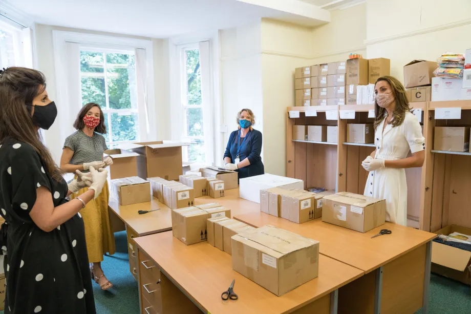 The Duchess of Cambridge helps unpack donations at Baby Basics UK. 