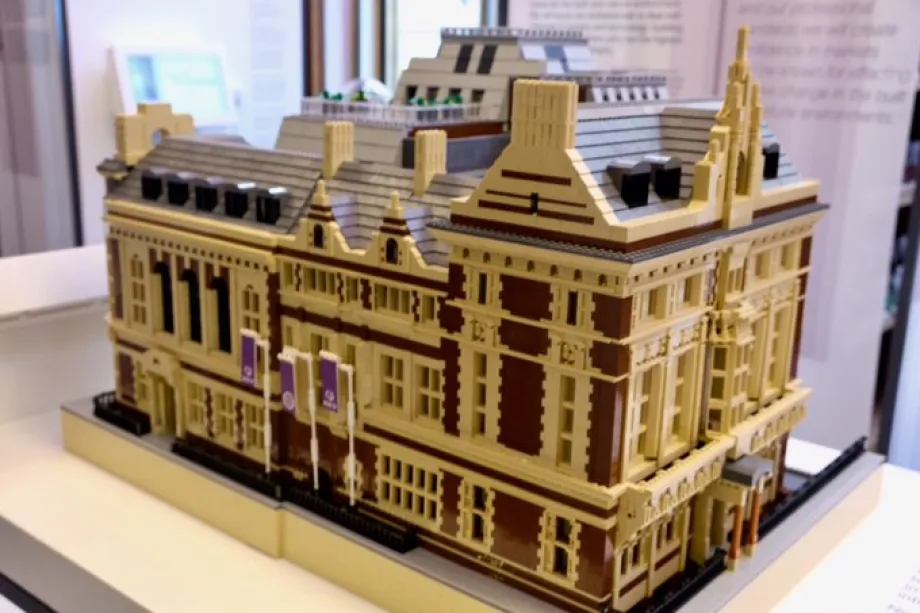 the queen views a lego model