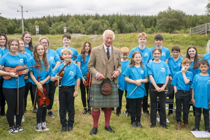 King Charles III meets members of the Feis air an Oir community music group during his visit to the Forsinard Flows Visitor Centre in Forsinard, Highland.jpg