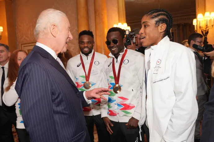 The King speaks to Cindy Ngamba at Buckingham Palace