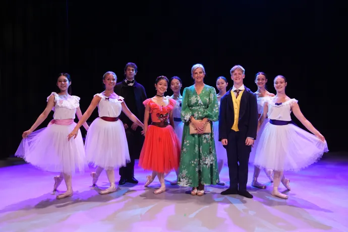 The Duchess of Edinburgh smiles alongside performers from the Central School of Ballet