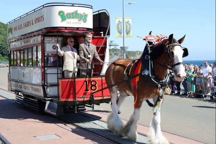The King rides on one of the horse trams during a visit to Douglas Promenade